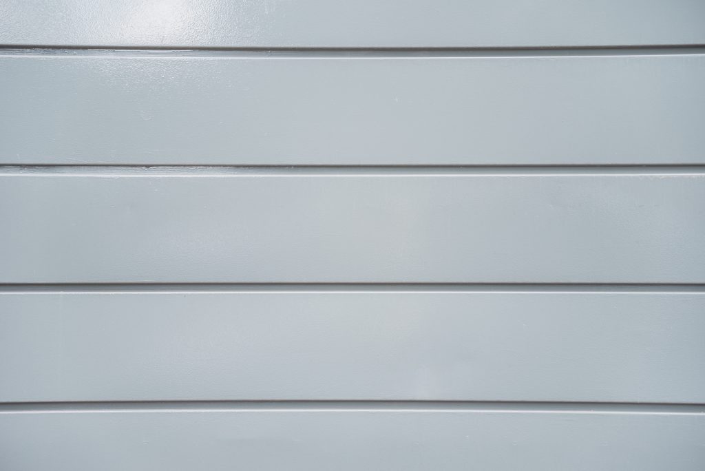 Texture light grey plastic panel wall